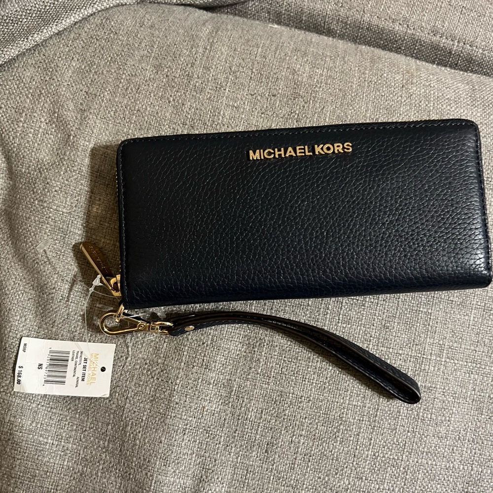 Brand new Michael Kors wallet with tags.